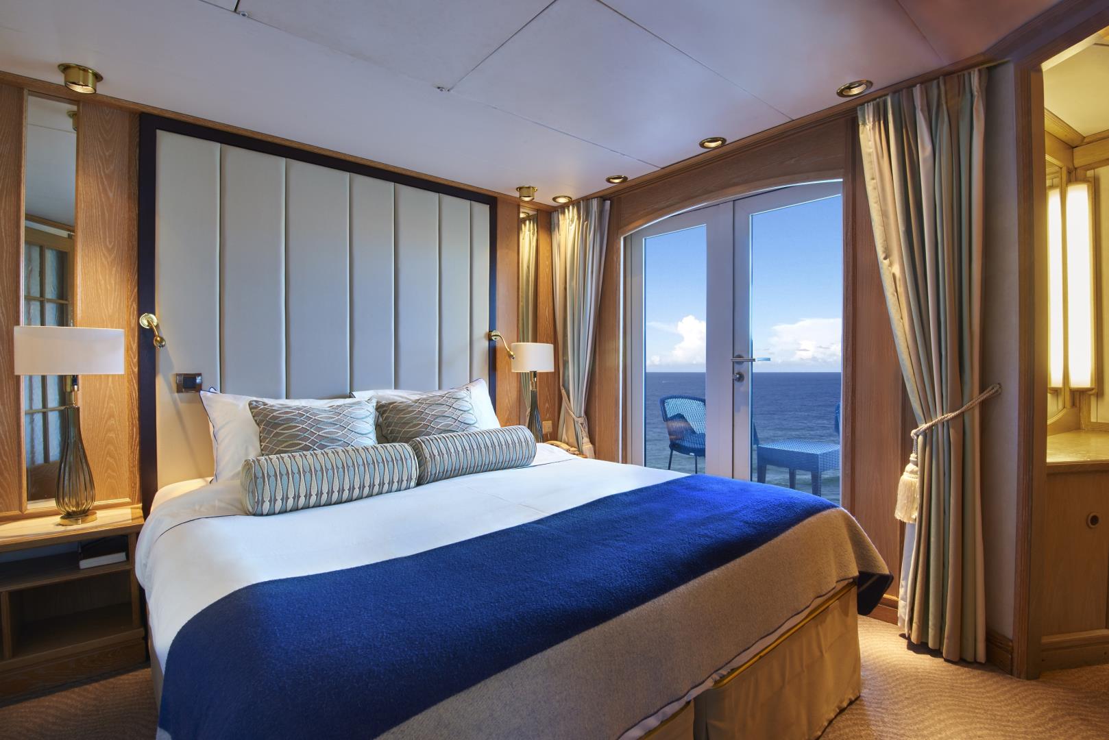 View of bed and balcony in Star Pride suite - Photo Credit: Gil Stose Photography